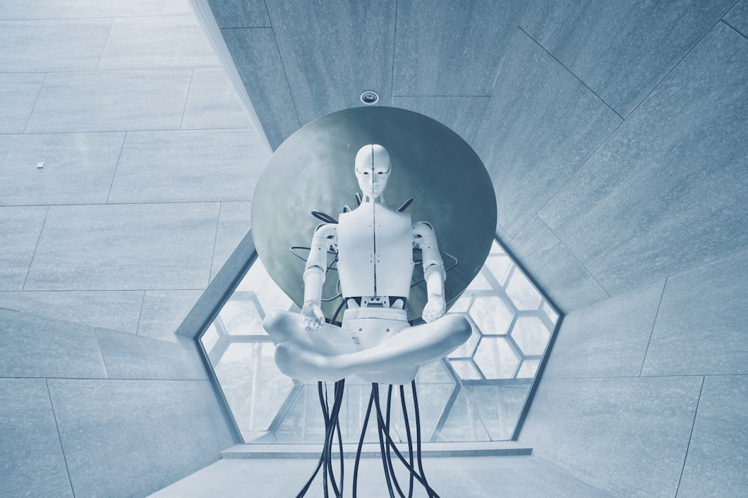 White humanoid robot standing in futuristic architecture – AI-powered machines